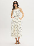 Robe mi-longue à pois et encolure carrée